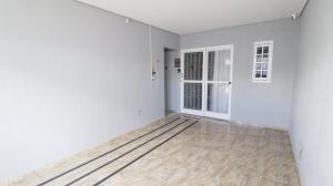 an empty room with white walls and a door at Studio 1 in Jundiaí