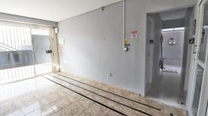 an empty hallway with a door in a building at Studio 1 in Jundiaí