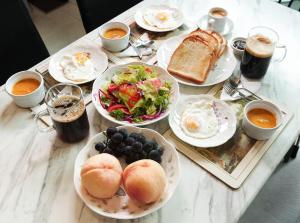 a table with plates of food and bowls of food at Eosahwa Hanok Stay Featured in Petit Futé 2026 in Jeonju