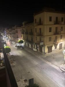 a view of a street at night with buildings at Elysium Luxury Suite in Trabia +10 photos