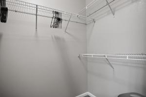 a tennis court with a net on a wall at Spacious 1-bedroom apartment with modern comforts in Dallas