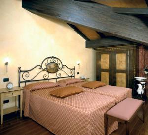 Ліжко або ліжка в номері Hotel La Cantina