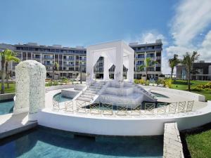 a resort with a swimming pool and a hotel at Majestic Elegance Costa Mujeres - All Inclusive in Cancún