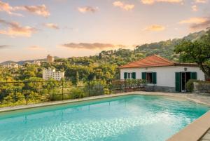 a swimming pool in front of a house at Villa with Pool e Jacuzzi Free Parking AC in San Lorenzo della Costa