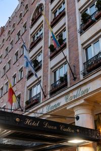 a building with flags on the front of it at Hotel Dann Carlton Bogota in Bogotá
