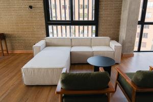 a living room with a couch and two chairs at Altitud Medellín Viem Living in Medellín