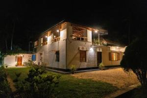 a house at night with lights on it at Don Padris Estate Bungalow in Tangalle