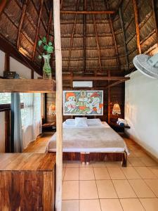 a bedroom with a bed in a hut at BOA BOA Bacalar in Bacalar +271 photos