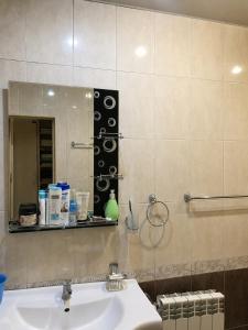 a bathroom with a sink and a mirror at Adams Rest House in Yeghegnadzor +63 photos