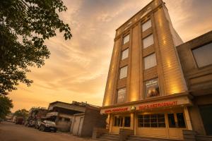 a building with a sign on the side of it at Hotel River Front in Kota +72 photos