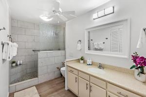 a bathroom with a sink and a shower and a toilet at OB - Lahaina Roads 308 in Lahaina