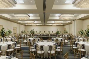 a banquet hall with white tables and chairs at Sheraton Baltimore North in Towson +38 photos