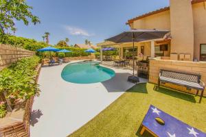 a swimming pool in the backyard of a house at Pool & Yard Games! Group Retreat in La Quinta in La Quinta