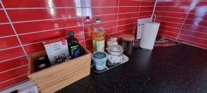 a kitchen counter with alcohol bottles on a counter top at Ditt andra hem in Kiruna