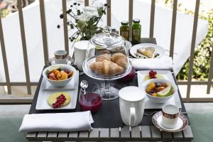 a tray of food on a table with food at Villa La Tuia B&B in Lucca