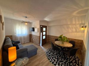 a living room with a couch and a table at GH Beiramar in Cee