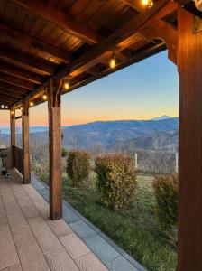 a porch with a view of the mountains at Villa Harmonia in Ferizaj