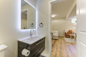 a bathroom with a sink and a mirror at Unwind centrally in West Kelowna +53 photos