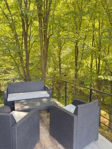 a patio with two chairs and a bench on a deck at ALBAK Green Zone in Gradačac +87 photos