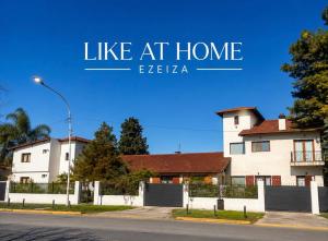 a sign that reads like at home ieelta in front of a house at Like at Home Ezeiza in Ezeiza