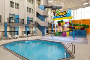 a pool in therium of a hotel with a water park at The Atlas° Hotel in Regina