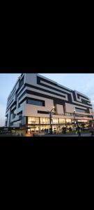 a large building with a lot of windows at White420 apartment in Rawalpindi
