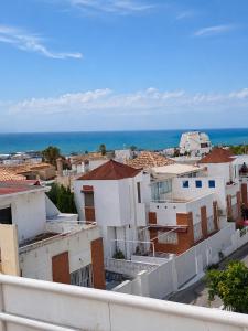 a city with white buildings and the ocean at Villa Bella in Los Altos