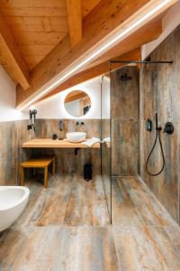 a bathroom with a glass shower and a sink at Hotel Villa Amabile in Villa dʼAllegno