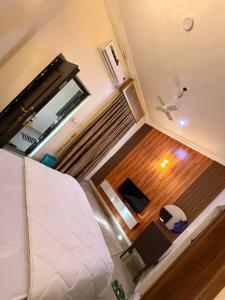 an overhead view of a room with a bed and a chair at Mario Suites Ltd in Kano