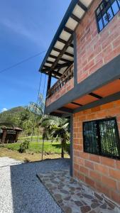 a brick building with a balcony on top of it at chalet Relajante, En San Rafael in San Rafael +15 photos