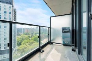 a balcony with a view of a city at Executive Studio w Balcony Steps to Eaton Centre in Toronto