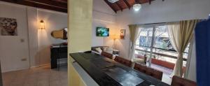 a living room with a table and chairs and a window at Recovas III in Pilar