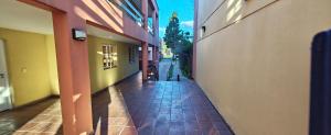 an empty hallway of a building with a sidewalk at Recovas III in Pilar