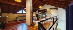 a large room with two beds and a staircase at Recovas III in Pilar