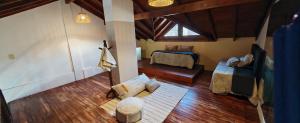 an overhead view of a attic room with a bedroom at Recovas III in Pilar +41 photos