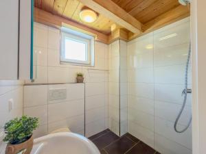 a bathroom with a sink and a shower at Kipaji 3 in Kötschach +33 photos