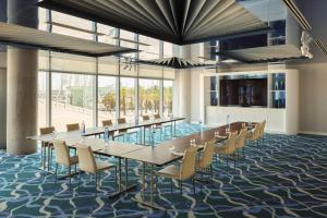 a large conference room with a long table and chairs at W Barcelona in Barcelona +280 photos