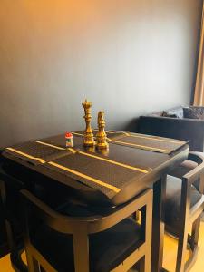 a chess board sitting on top of a table at Colombo Trizen Nuva Apartments in Colombo