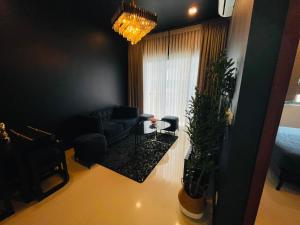 a living room with a couch and a table at Colombo Trizen Nuva Apartments in Colombo