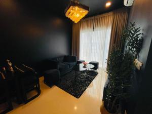 a living room with a couch and a window at Colombo Trizen Nuva Apartments in Colombo