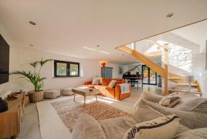 a living room with a couch and a table at Treloggas Retreat in Truro +81 photos