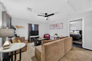 a living room with a couch and a table at Cozy Heights 2 BD Bungalow, Walkable in Houston