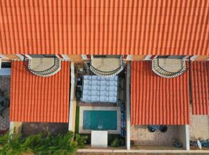 an overhead view of a building with orange roofs at Gold coast beautiful house with private pool in Palm-Eagle Beach