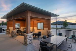 a gazebo with tables and chairs on a patio at TownePlace Suites by Marriott Minot in Minot
