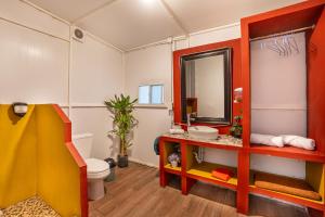 a bathroom with a toilet and a sink and a mirror at Glamping-Zingo in Santa Ana Jilotzingo +27 photos