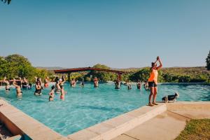 a group of people in a swimming pool at Agua Dorada Apart in Cavalango