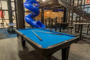 a pool table in a room with at Kimpton Cardinal Hotel by IHG in Winston-Salem +66 photos