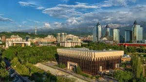 a view of a city with buildings and trees at InterContinental Almaty by IHG in Almaty