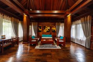 a living room with a couch and a table at Try Palace Resort Kep in Kep