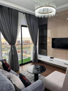 a living room with a couch and a table at Pcg Homes in Lagos